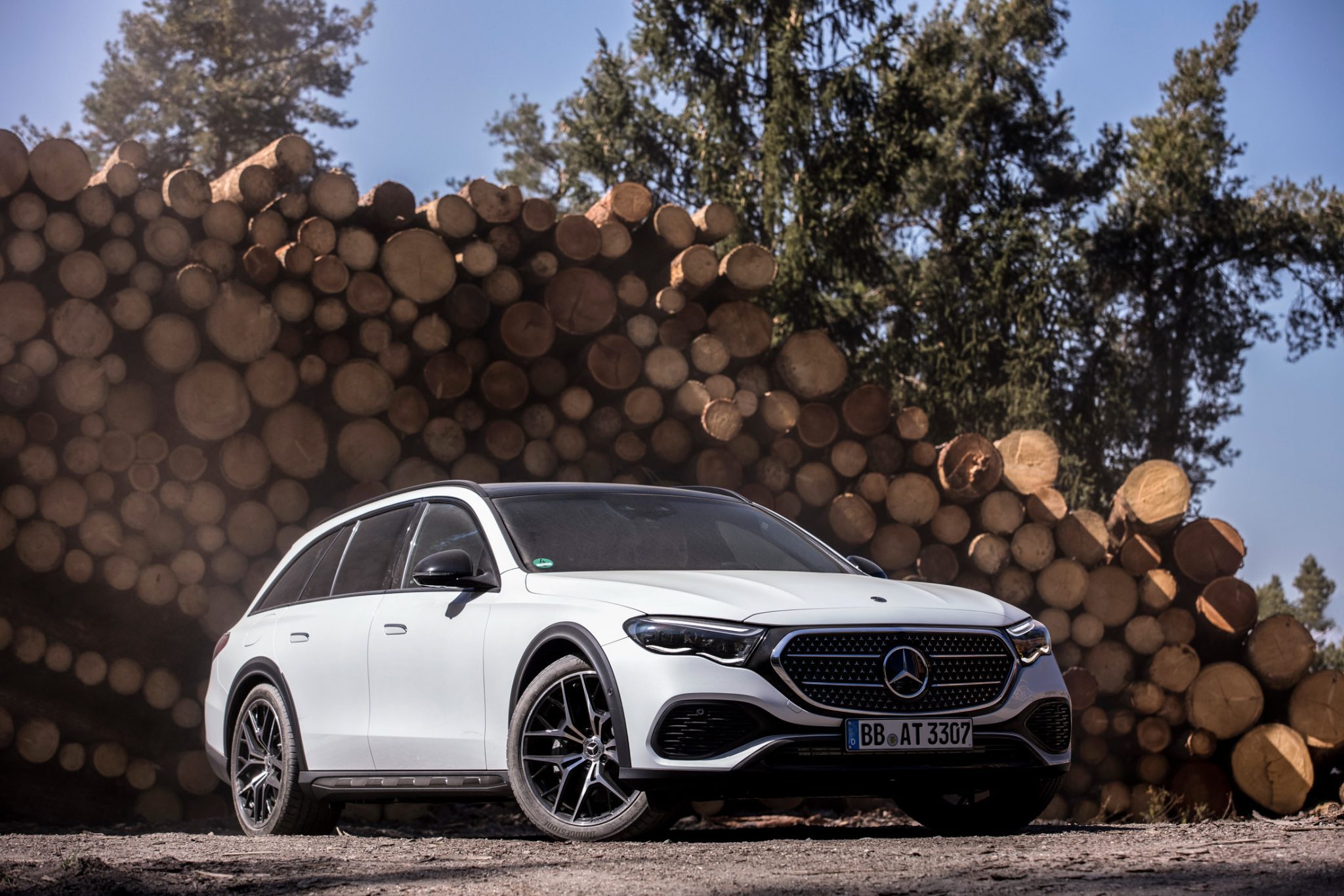 Front-angled view of a white Mercedes Benz E450 4MATIC All-Terrain Wagon