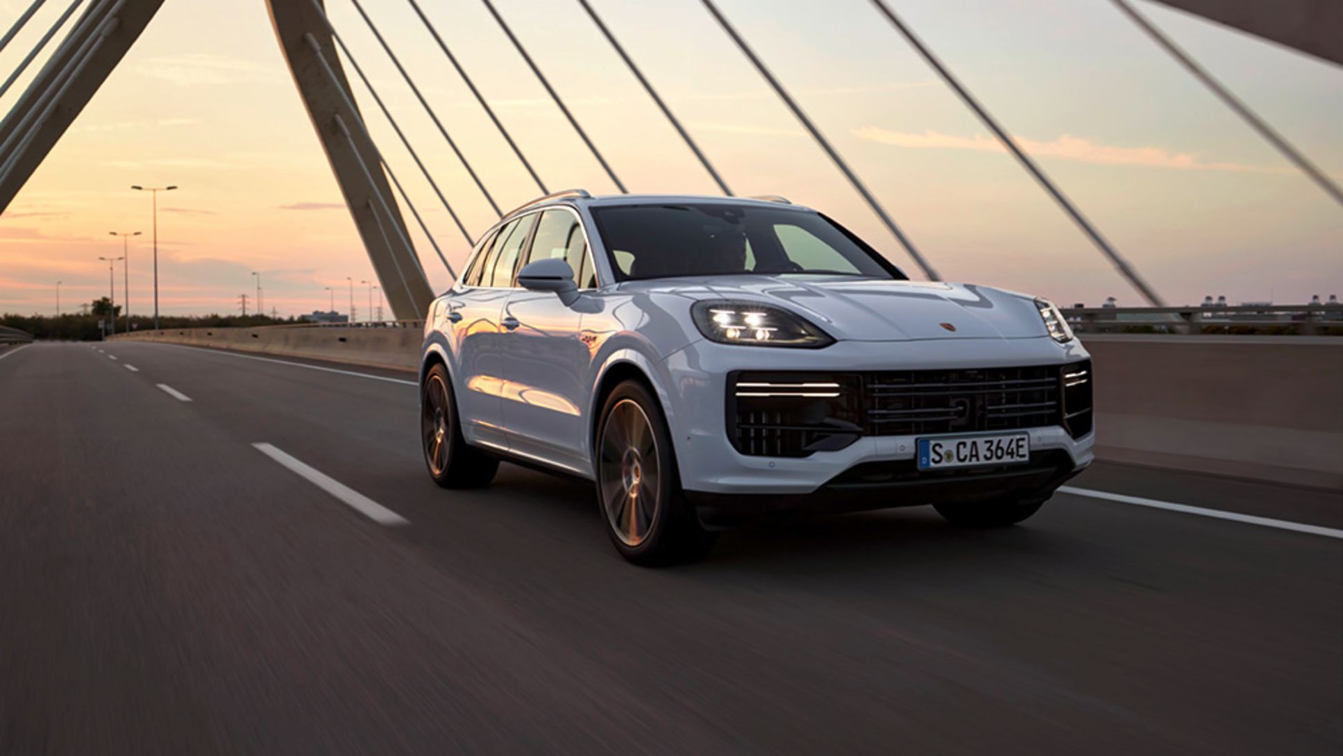 Front-angled view of a white 2024 Porsche Cayenne Turbo E-Hybrid
