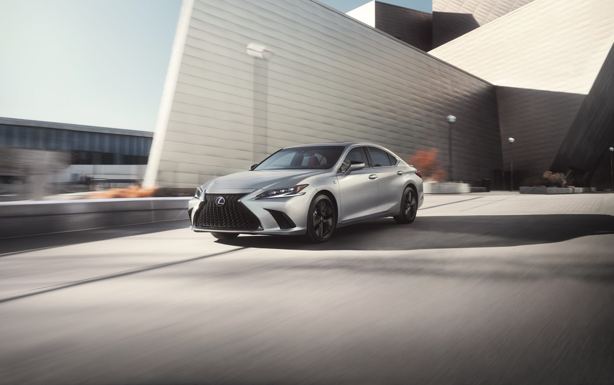 Three-quarter front view of a 2024 silver Lexus ES Hybrid