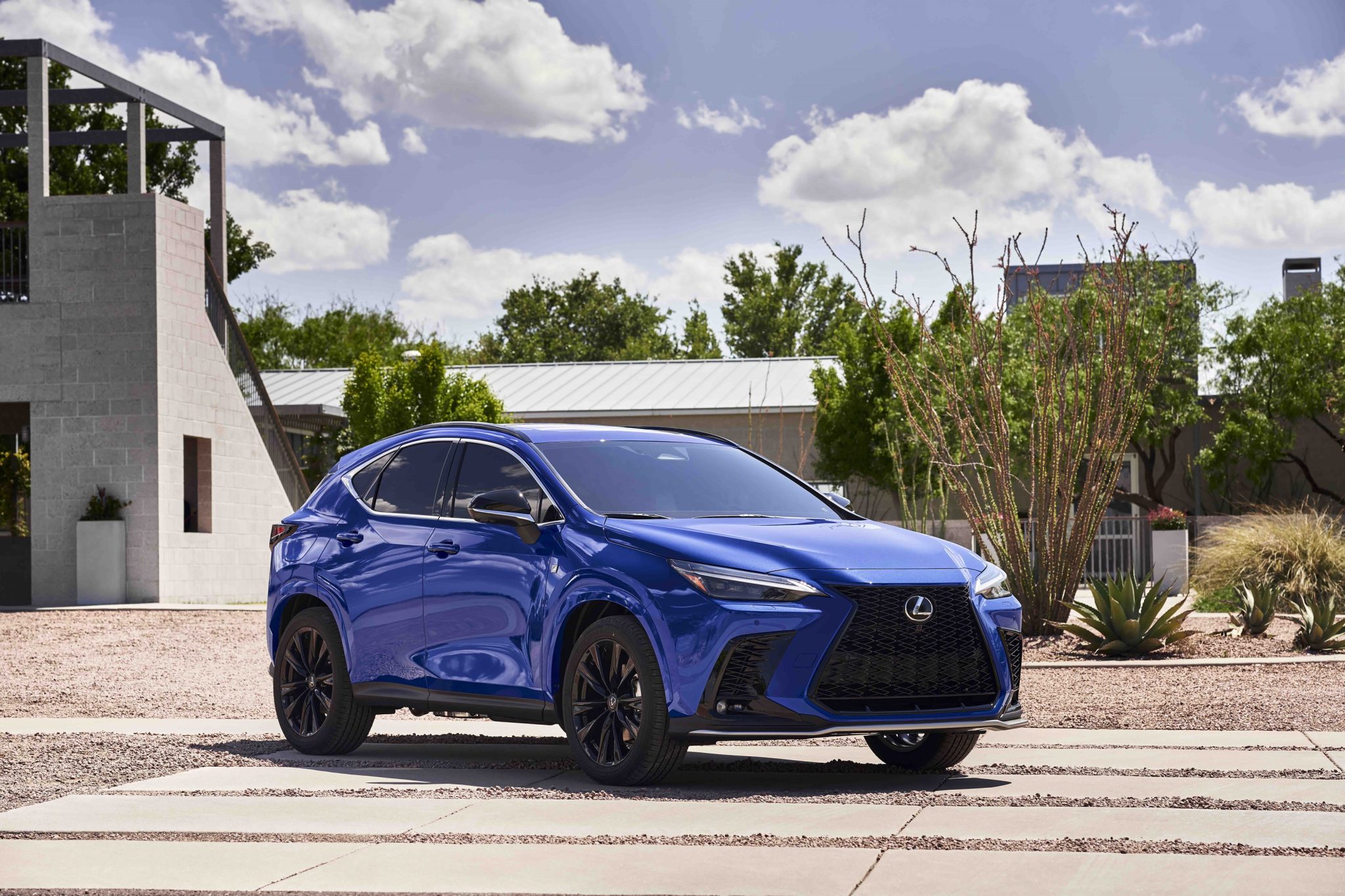 Three-quater front view of a 2024 blue Lexus NX 450h