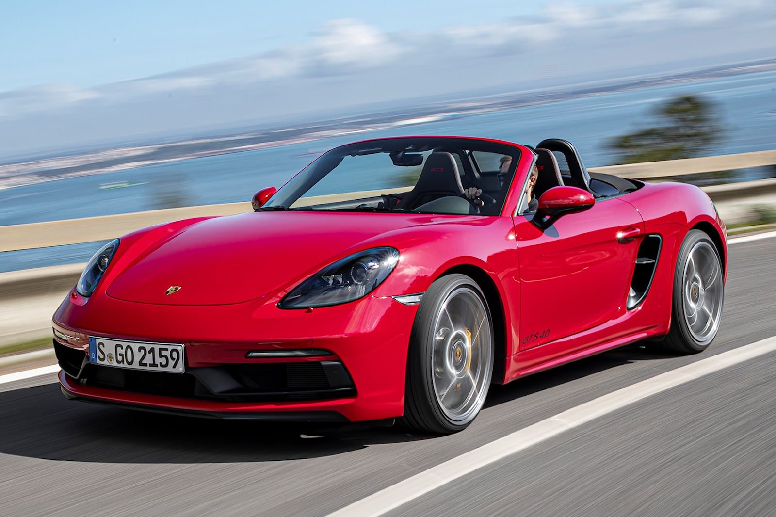 Front-angled view of a red Porsche 718 Boxster.
