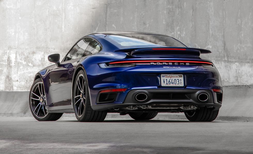 Rear-angled view of a blue Porsche 911 Turbo S