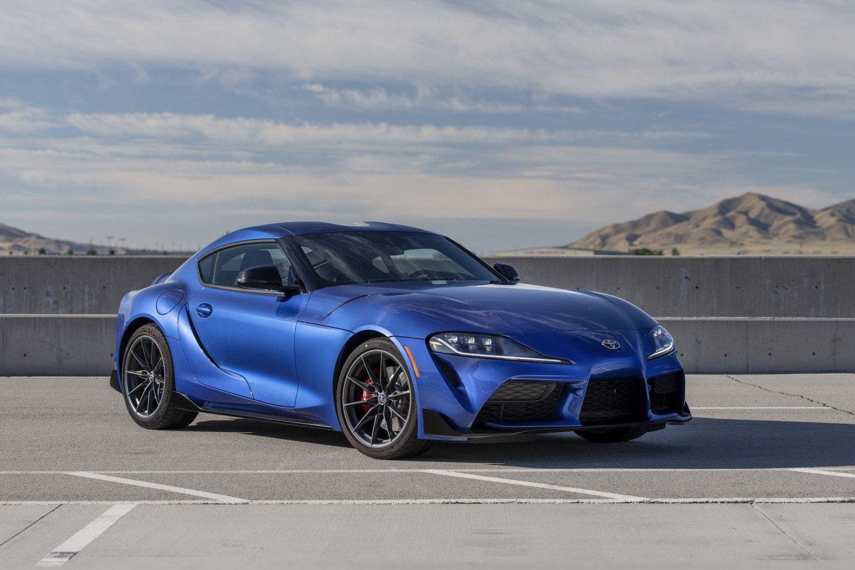 Front-angled view of a blue Toyota GR Supra