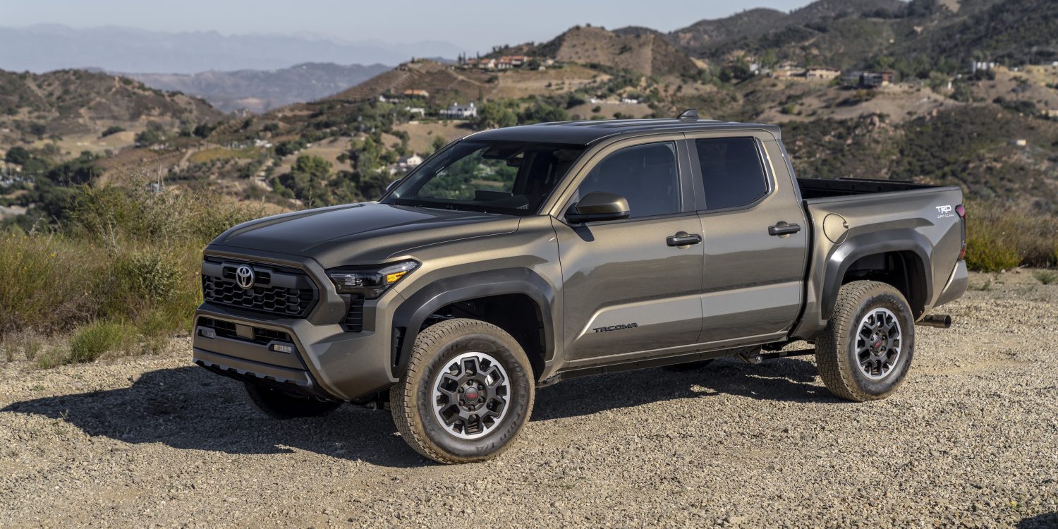Side view of a 2024 grey Toyota Tacoma TRD Off Road on a trail