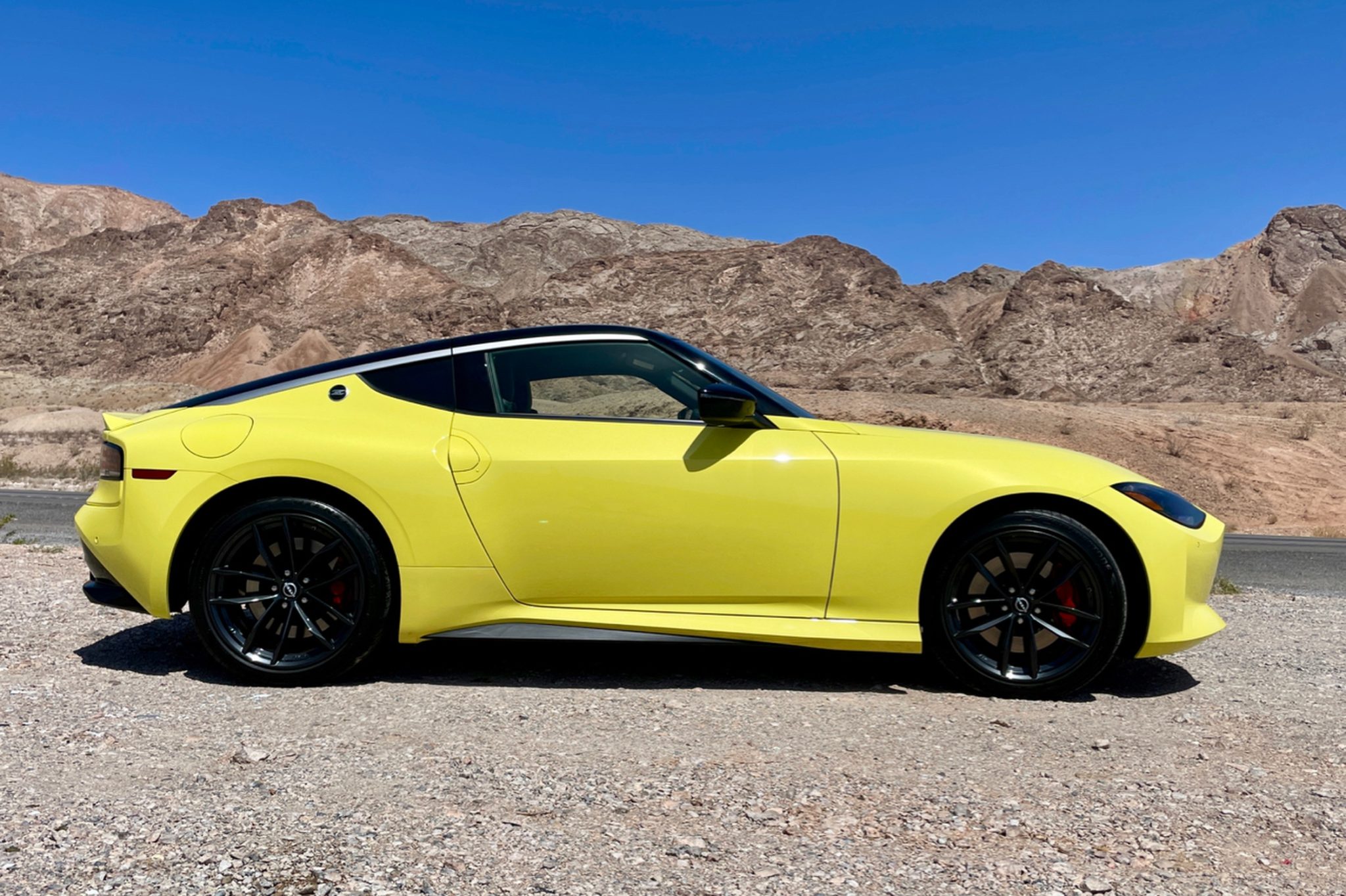 side profile of a yellow Nissan Z