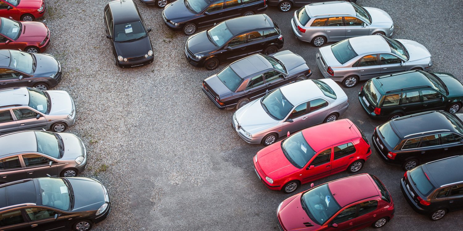 overhead shot of cars in a dealer lot