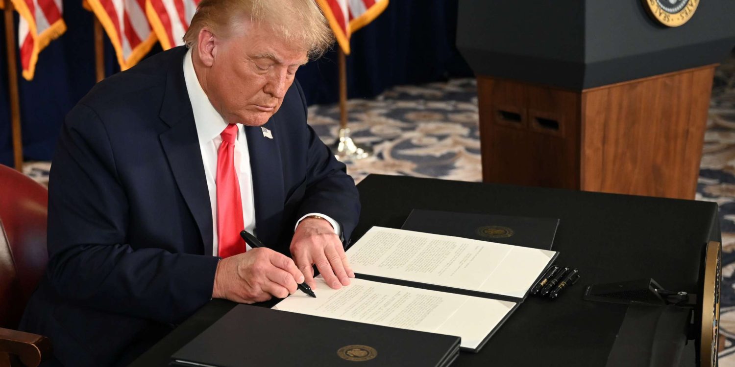 Trump signing an executive order