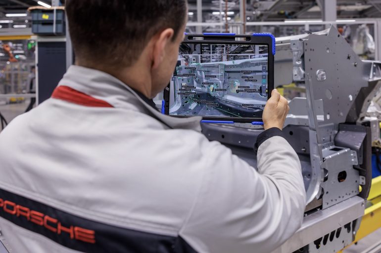Porsche woker at body construction facility, Porsche plant Leipzig.